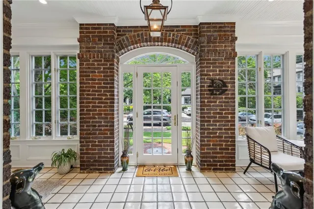 a view of front door with outdoor seating