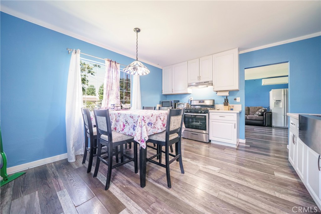 2137 Pepper Drive Highland, CA 92346 - Photo 11 of 35 a view of a dining room with furniture window and wooden floor