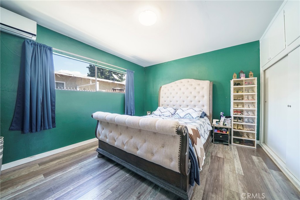 2137 Pepper Drive Highland, CA 92346 - Photo 15 of 35 a bedroom with a bed and a window