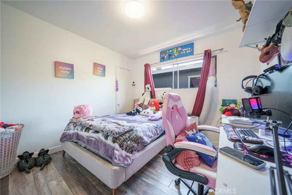 2137 Pepper Drive Highland, CA 92346 - Photo 18 of 35 a bed room with a bed and a desk