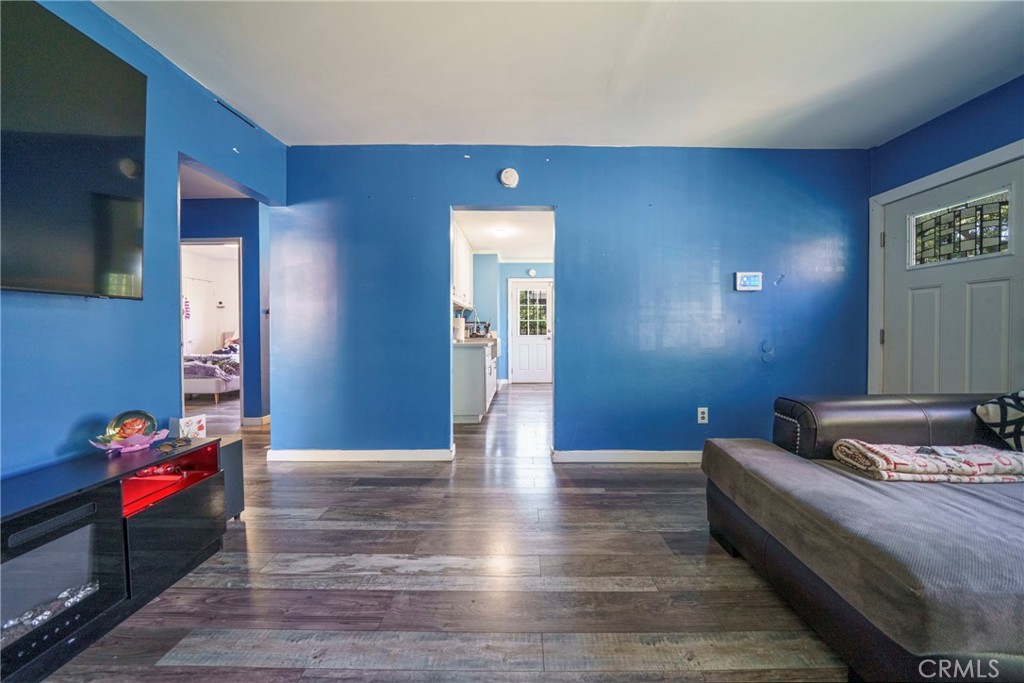 2137 Pepper Drive Highland, CA 92346 - Photo 7 of 35 a living room with furniture and a gate
