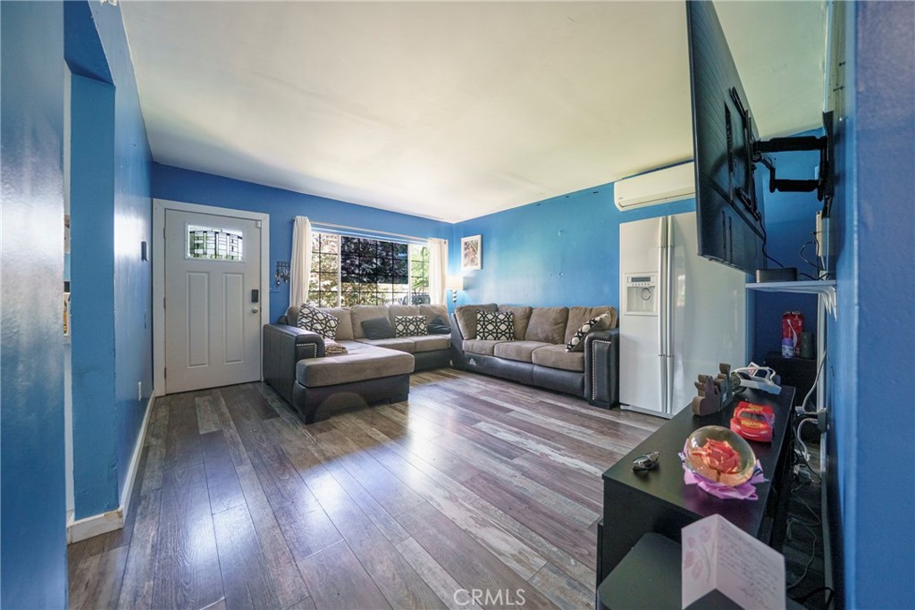 2137 Pepper Drive Highland, CA 92346 - Photo 8 of 35 a living room with furniture and a fireplace