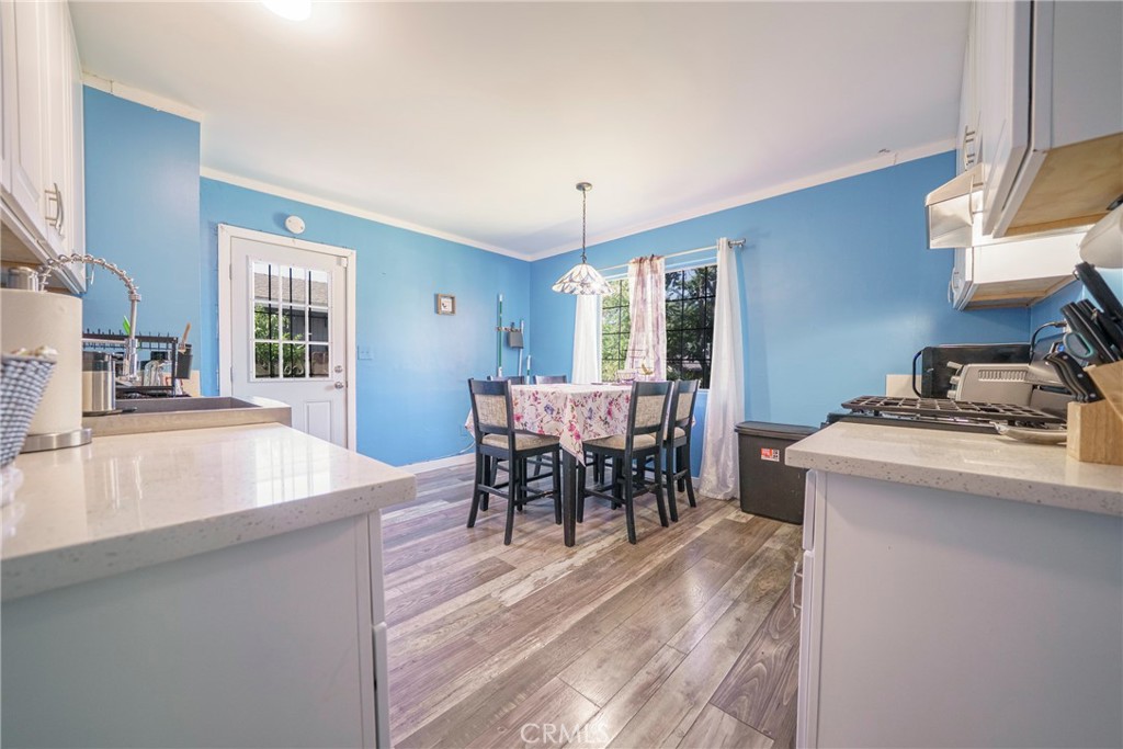 2137 Pepper Drive Highland, CA 92346 - Photo 10 of 35 a view of a dining room with furniture and chandelier