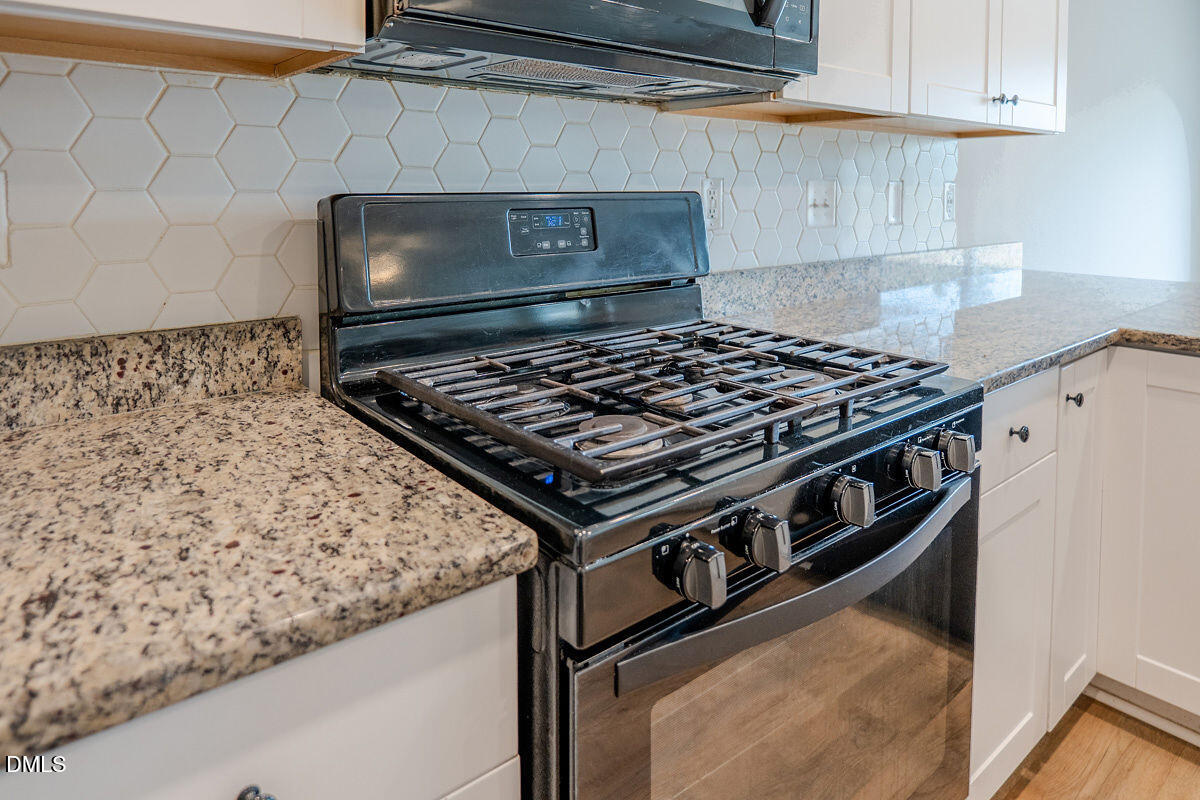 2036 Alderman Way Creedmoor, NC 27522 - Photo 13 of 49 a stove top oven sitting inside of a kitchen