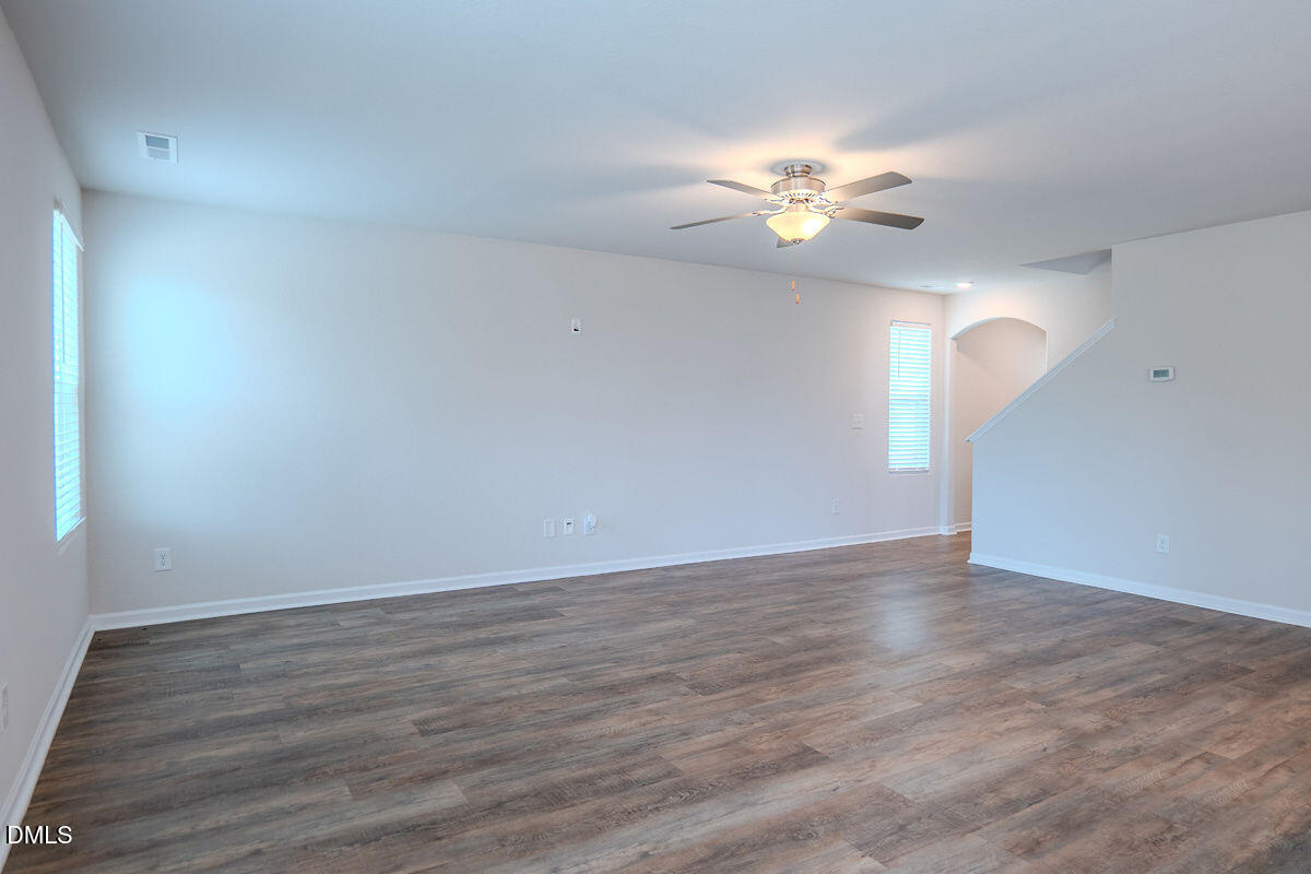2036 Alderman Way Creedmoor, NC 27522 - Photo 15 of 49 a view of an empty room with window and wooden floor