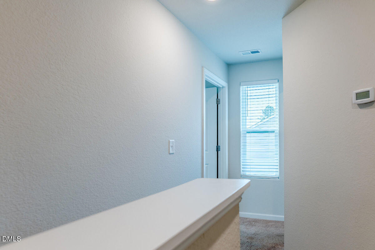 2036 Alderman Way Creedmoor, NC 27522 - Photo 22 of 49 a room with a bed and a window