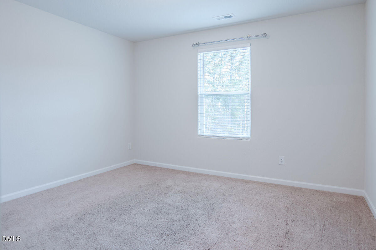 2036 Alderman Way Creedmoor, NC 27522 - Photo 31 of 49 an empty room with a window