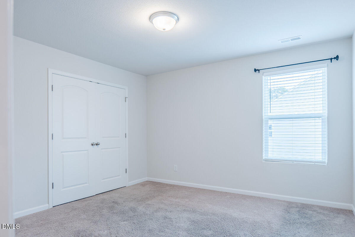 2036 Alderman Way Creedmoor, NC 27522 - Photo 33 of 49 an empty room with windows