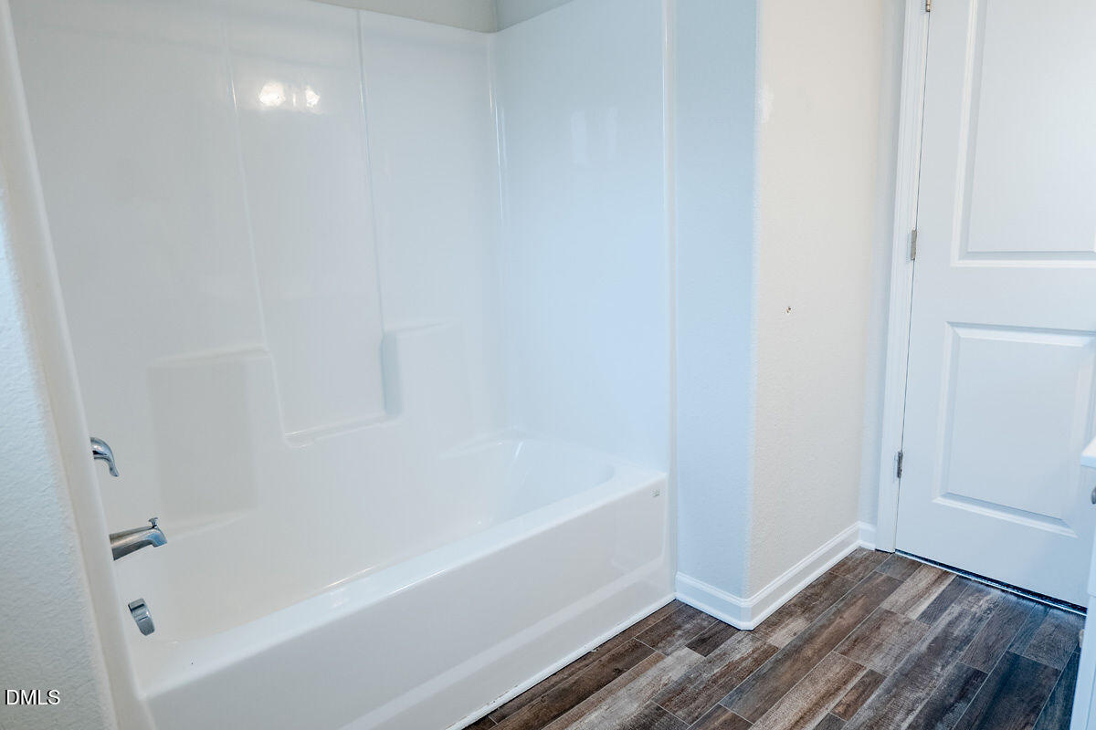 2036 Alderman Way Creedmoor, NC 27522 - Photo 39 of 49 a bathroom with a bathtub