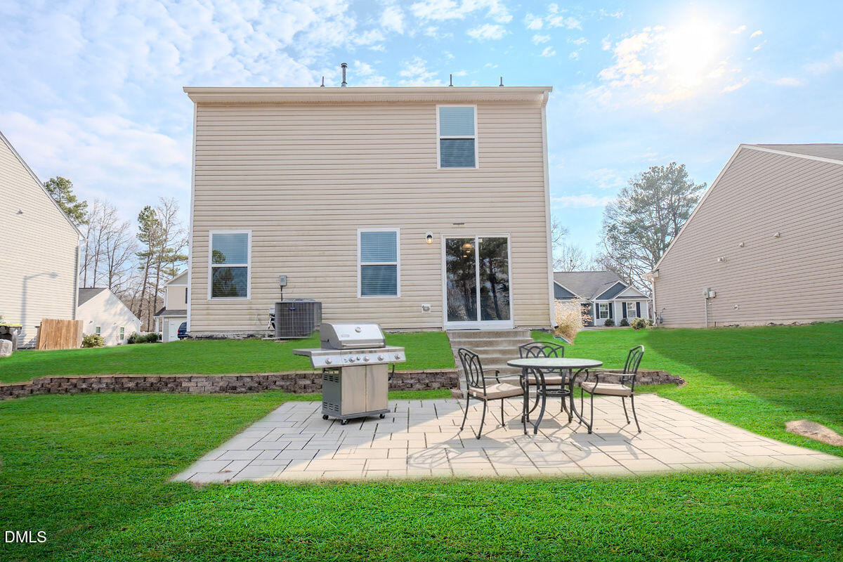 2036 Alderman Way Creedmoor, NC 27522 - Photo 47 of 49 a view of backyard of house with a patio