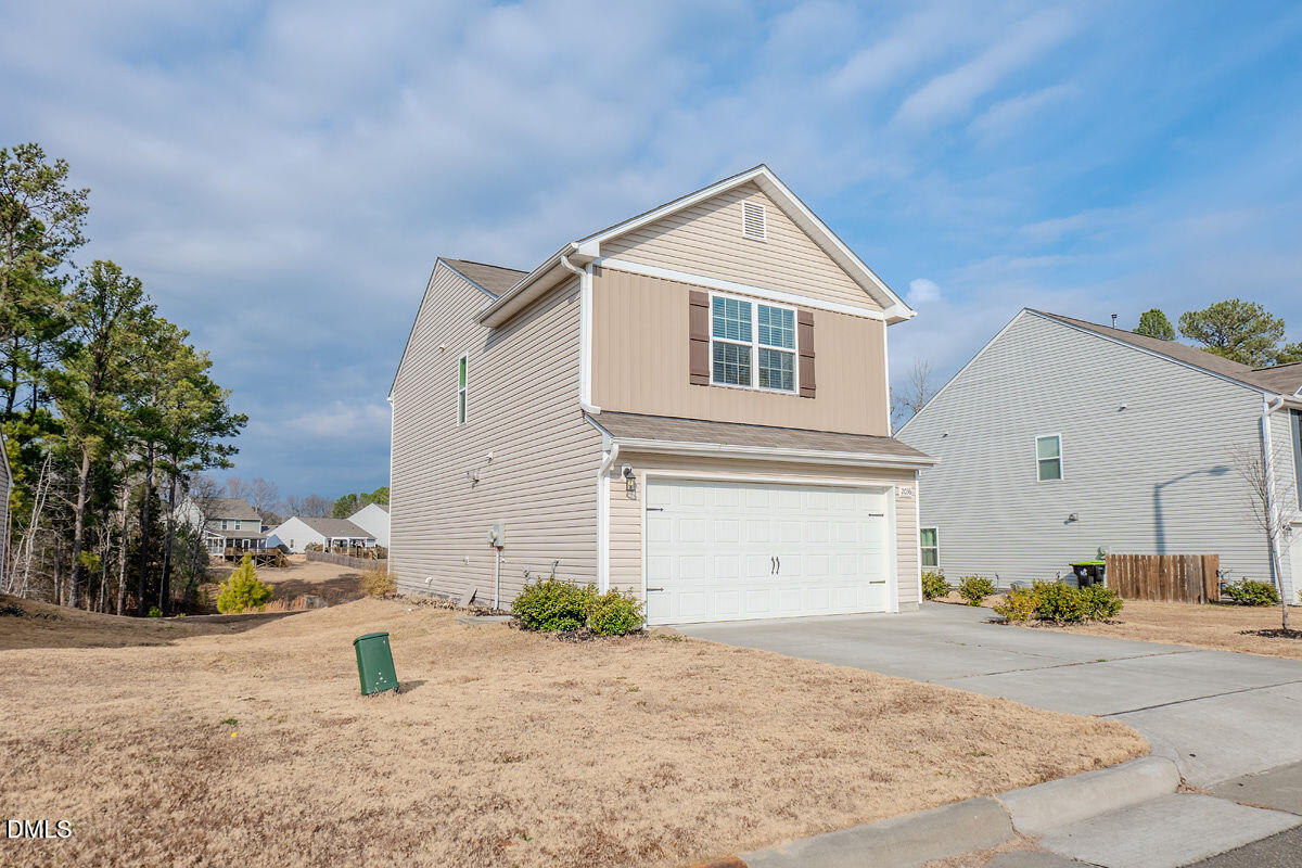 2036 Alderman Way Creedmoor, NC 27522 - Photo 6 of 49 a front view of a house with a yard
