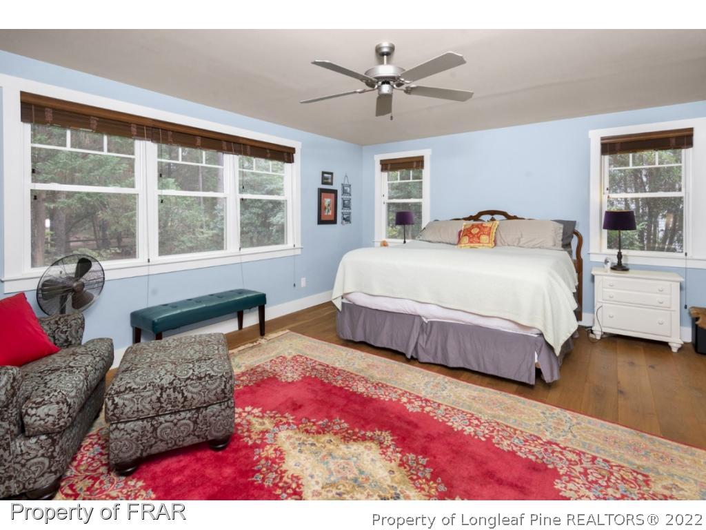 6839 Uppingham Road Fayetteville, NC 28306 - Photo 18 of 36 a bedroom with a large bed and a window