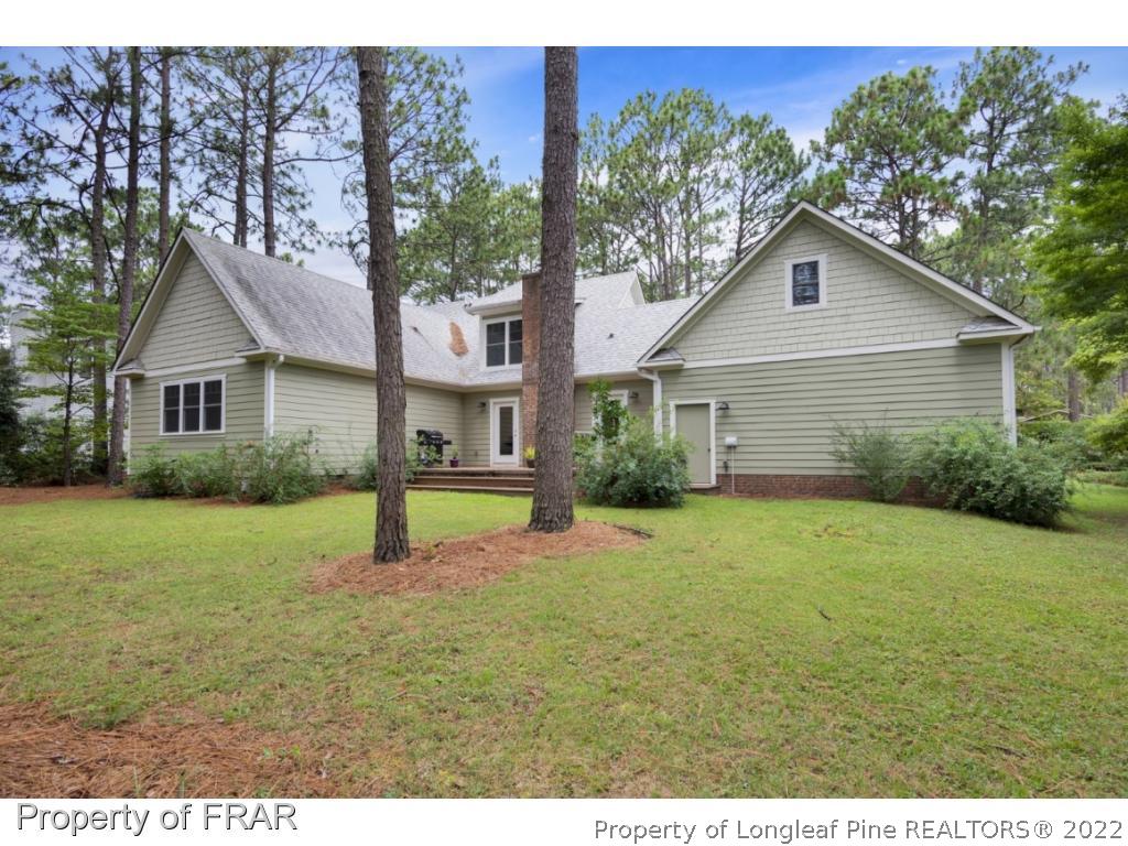 6839 Uppingham Road Fayetteville, NC 28306 - Photo 33 of 36 a house view with a garden space