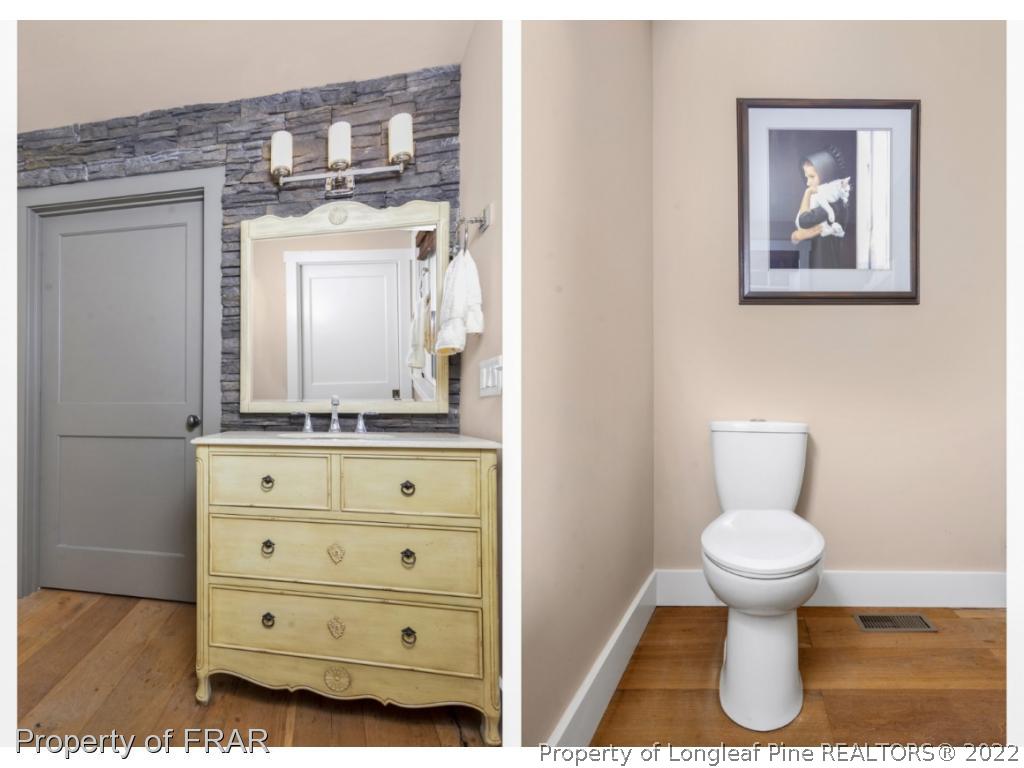 6839 Uppingham Road Fayetteville, NC 28306 - Photo 6 of 36 a bathroom with a toilet sink and mirror