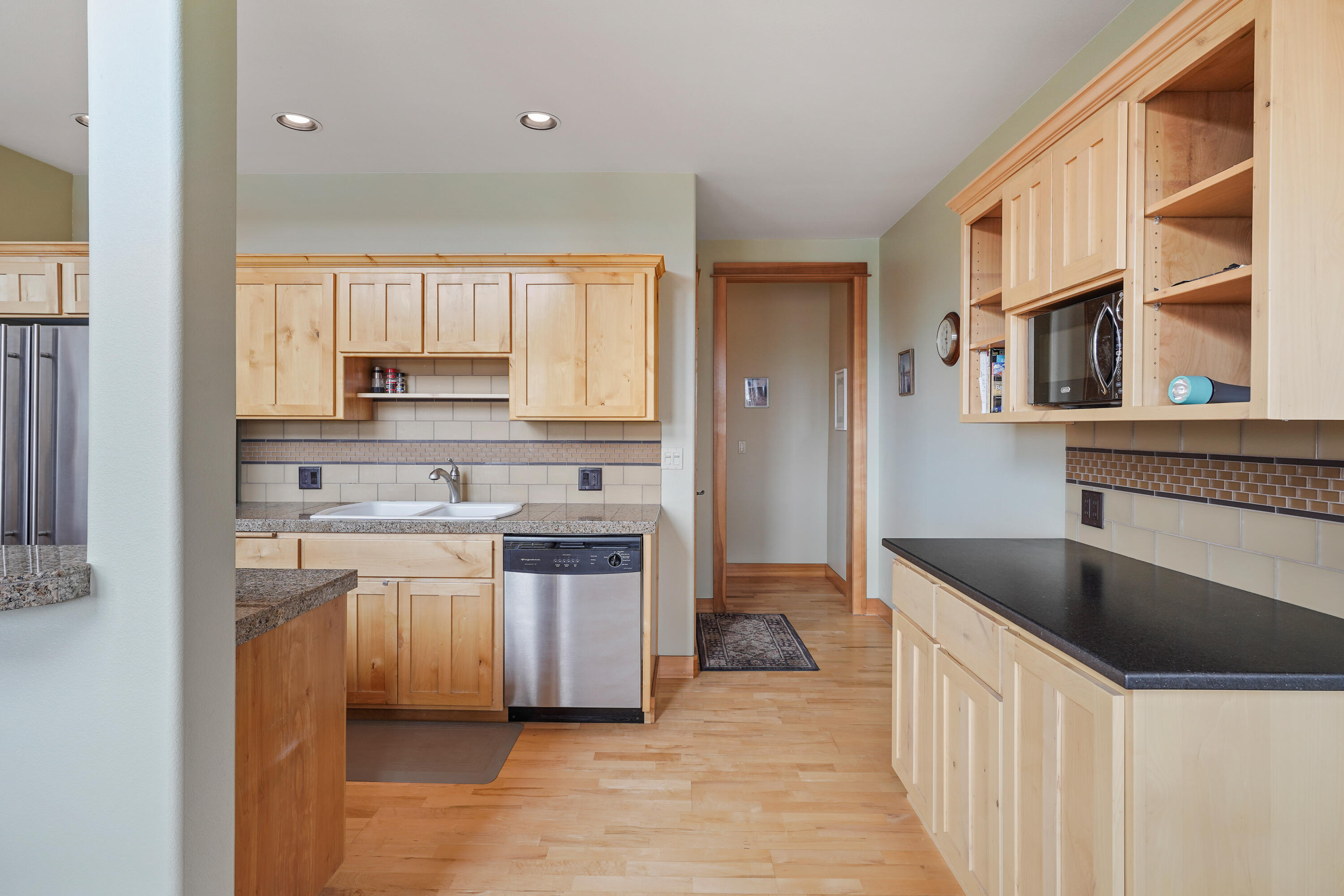 2155 Northwest Awbrey Road Bend, OR 97703 - Photo 12 of 44 a kitchen with a stove a sink and a refrigerator