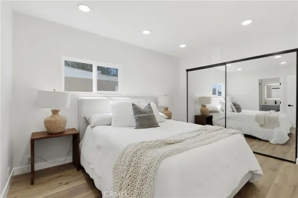 a bedroom with bed and a couch