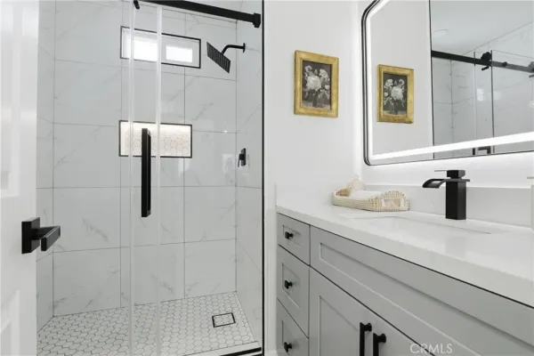 a bathroom with a sink and mirror