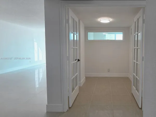 a view of a bathroom from the hallway