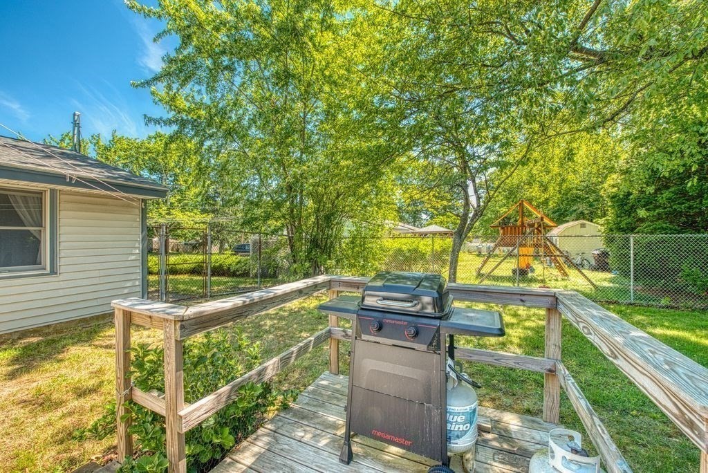 81 Errol Road Brockton, MA 02302 - Photo 30 of 31 a balcony with wooden floor and outdoor space