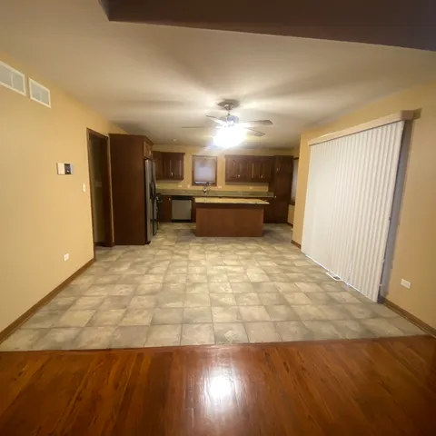 a view of a livingroom with a kitchen