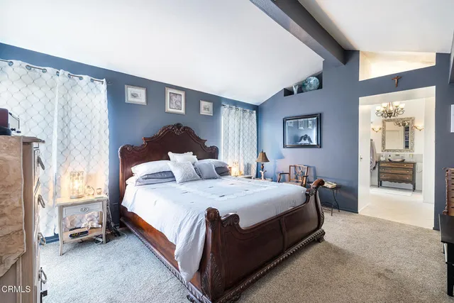 a bed room with a bed and a couch