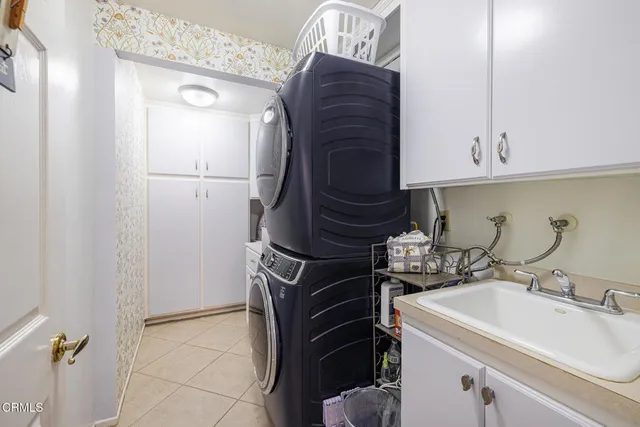 a kitchen with a sink and a stove top oven