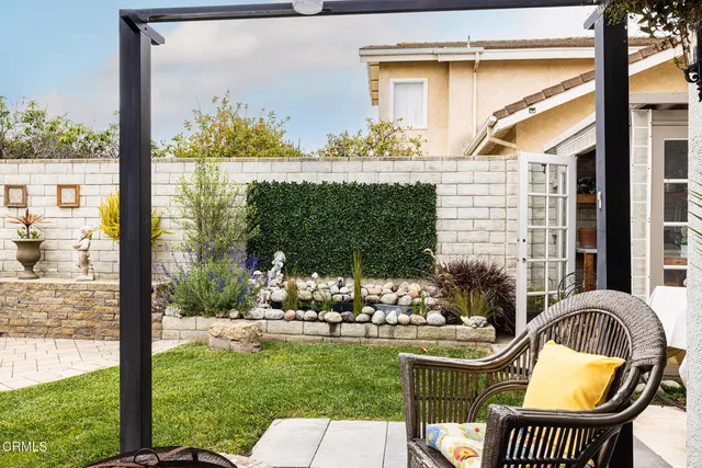 a view of a sitting area with furniture and garden