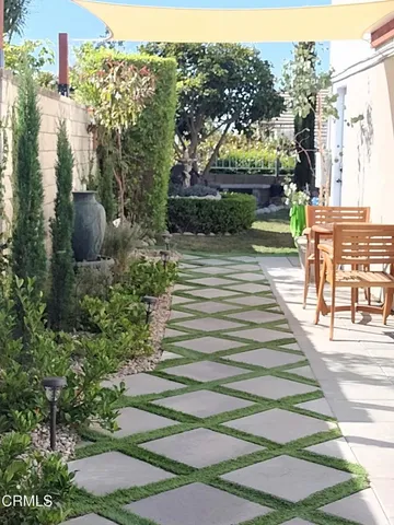 a view of a garden with a fountain