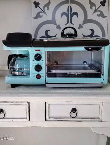 a bathroom with a sink toilet and mirror