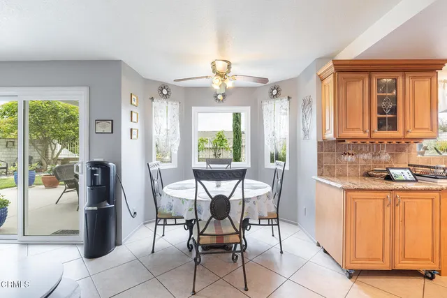 a view of a dining room with furniture window and outside view