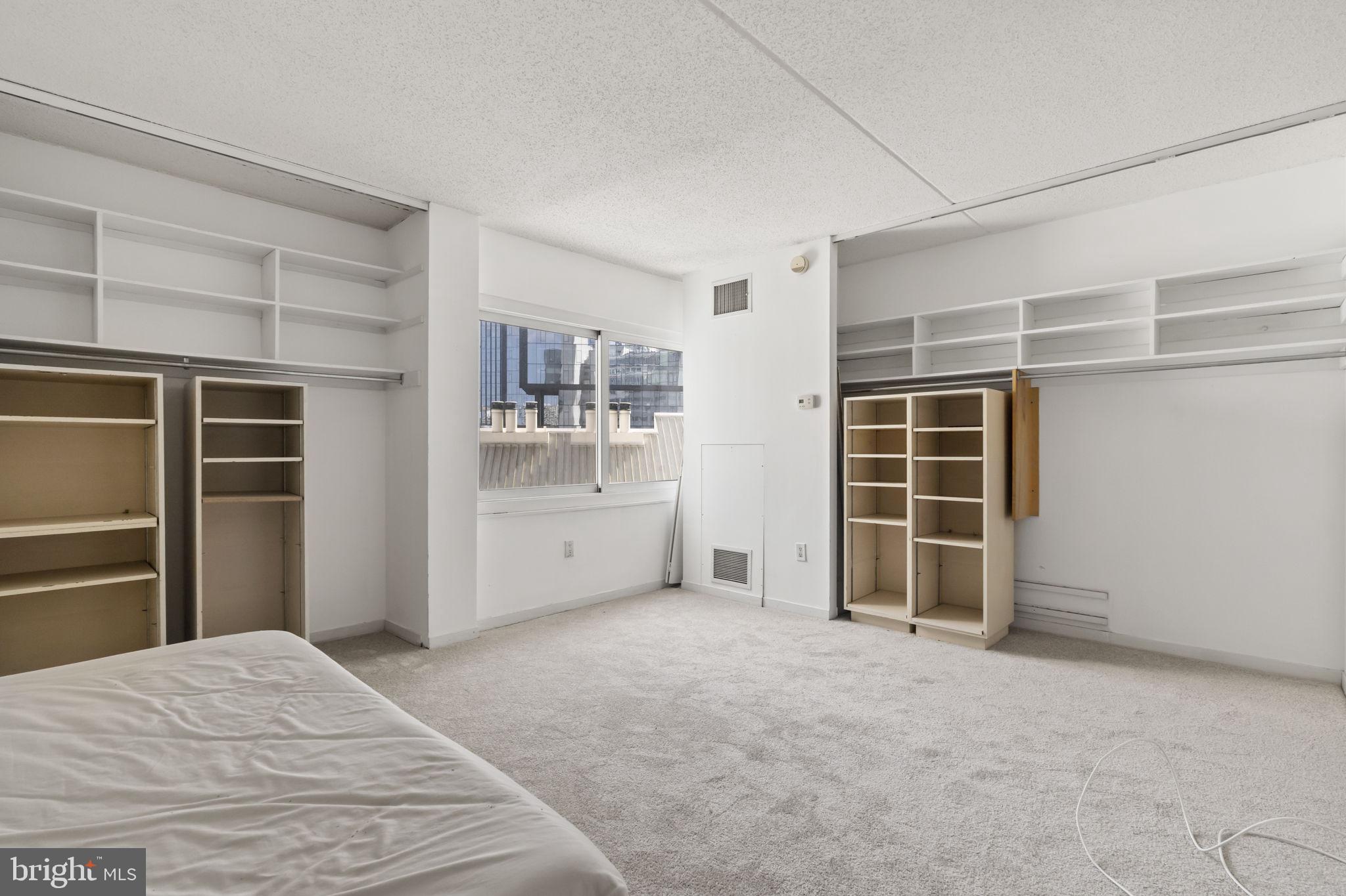 2301 Cherry Street, Unit 6F Philadelphia, PA 19103 - Photo 18 of 30 a view of empty room with cabinet and door