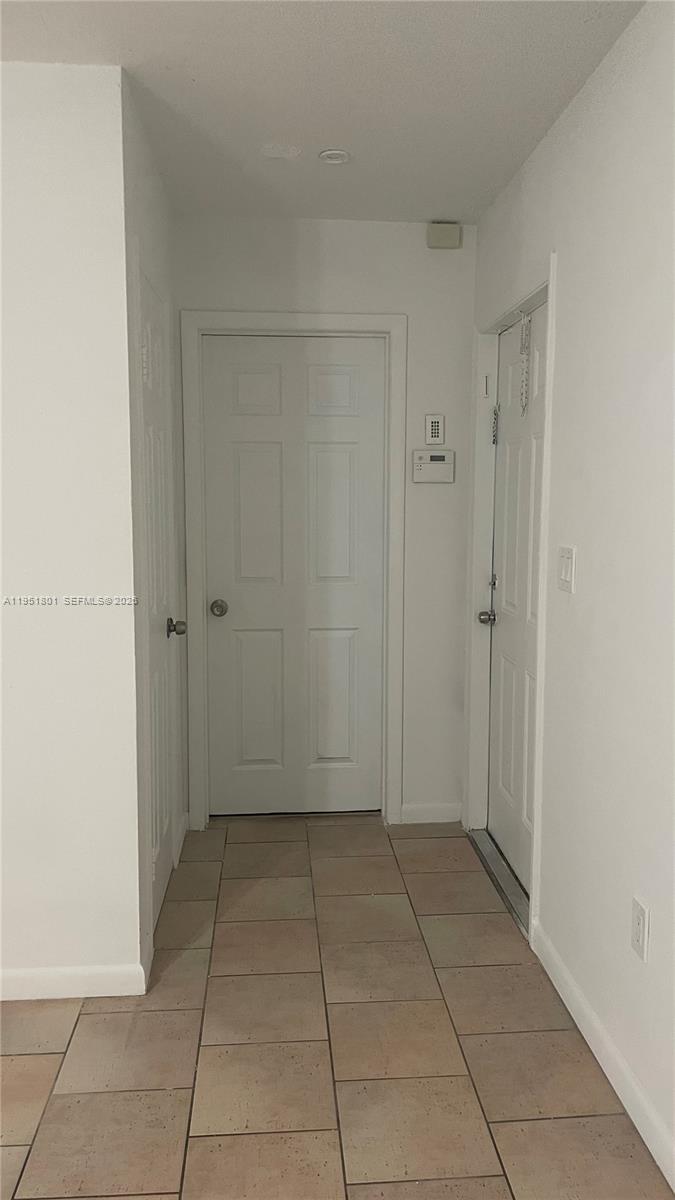 9810 Southwest 165th Terrace, Unit 9810 Miami, FL 33157 - Photo 13 of 17 a view of an empty room