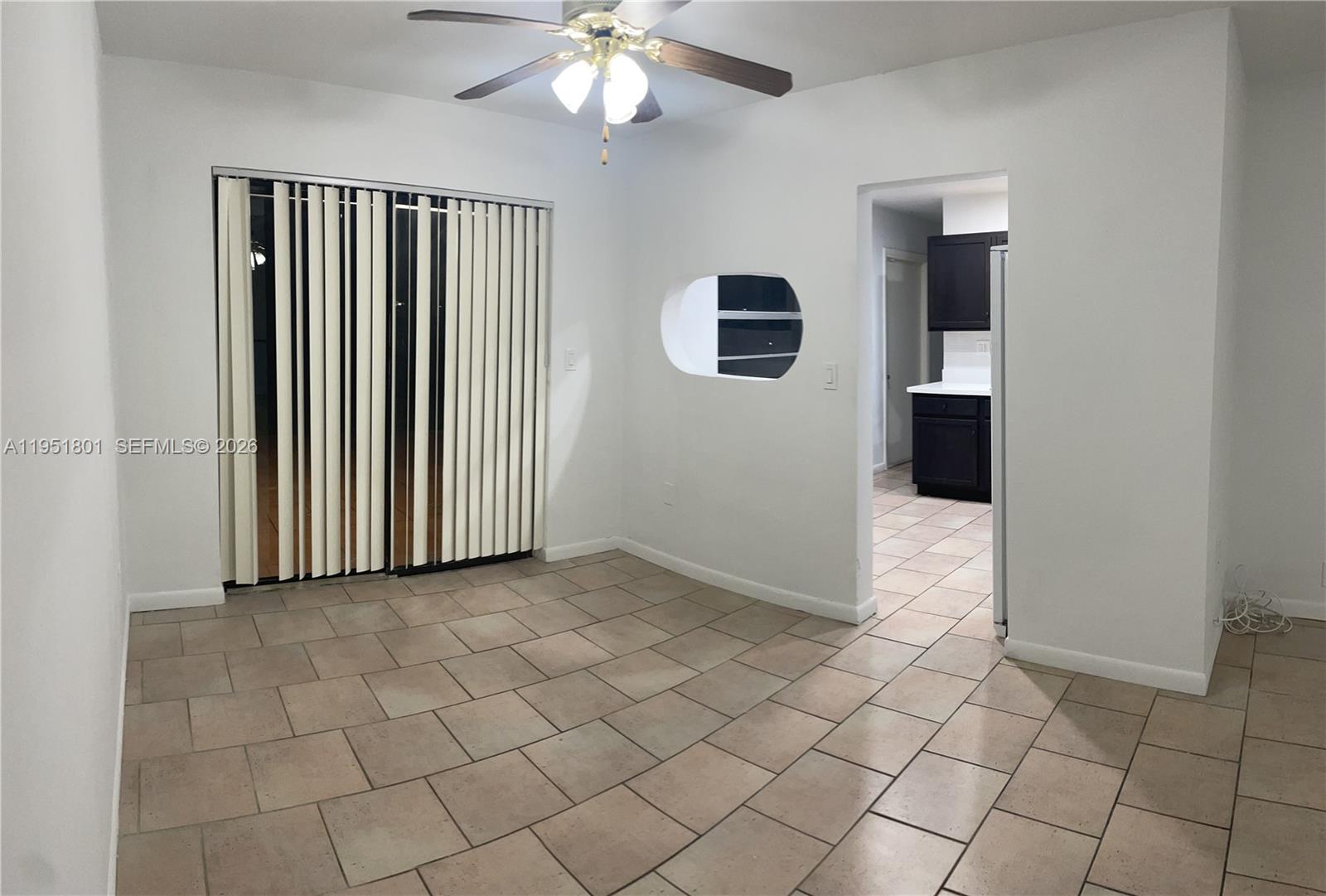 9810 Southwest 165th Terrace, Unit 9810 Miami, FL 33157 - Photo 15 of 17 an empty room with windows