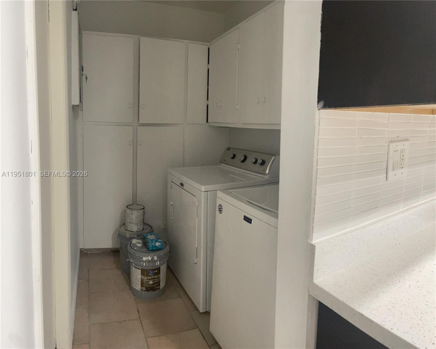 9810 Southwest 165th Terrace, Unit 9810 Miami, FL 33157 - Photo 17 of 17 a room with a sink and cabinets