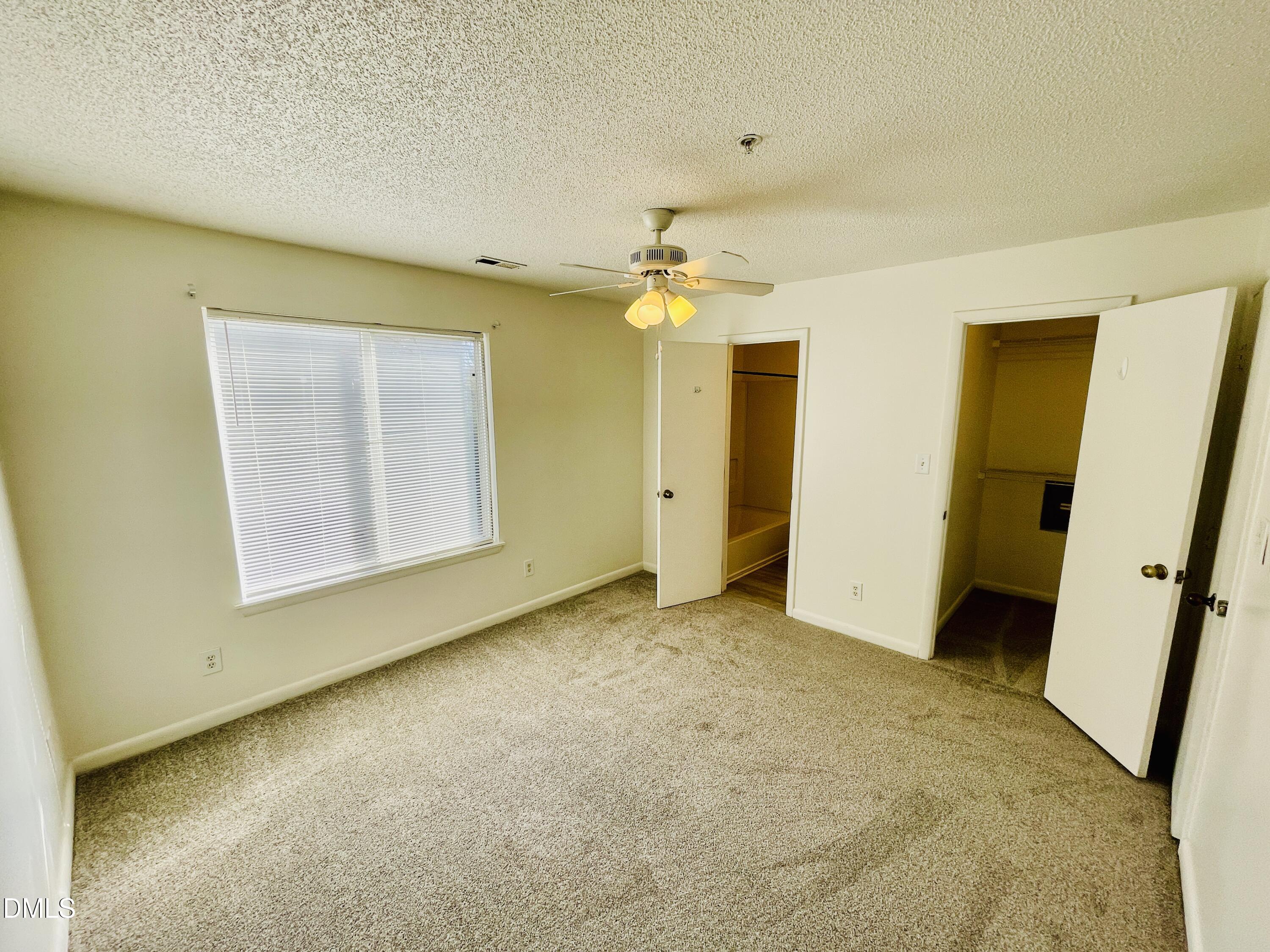 1230 University Court, Unit 204 Raleigh, NC 27606 - Photo 11 of 17 an empty room with a bathroom