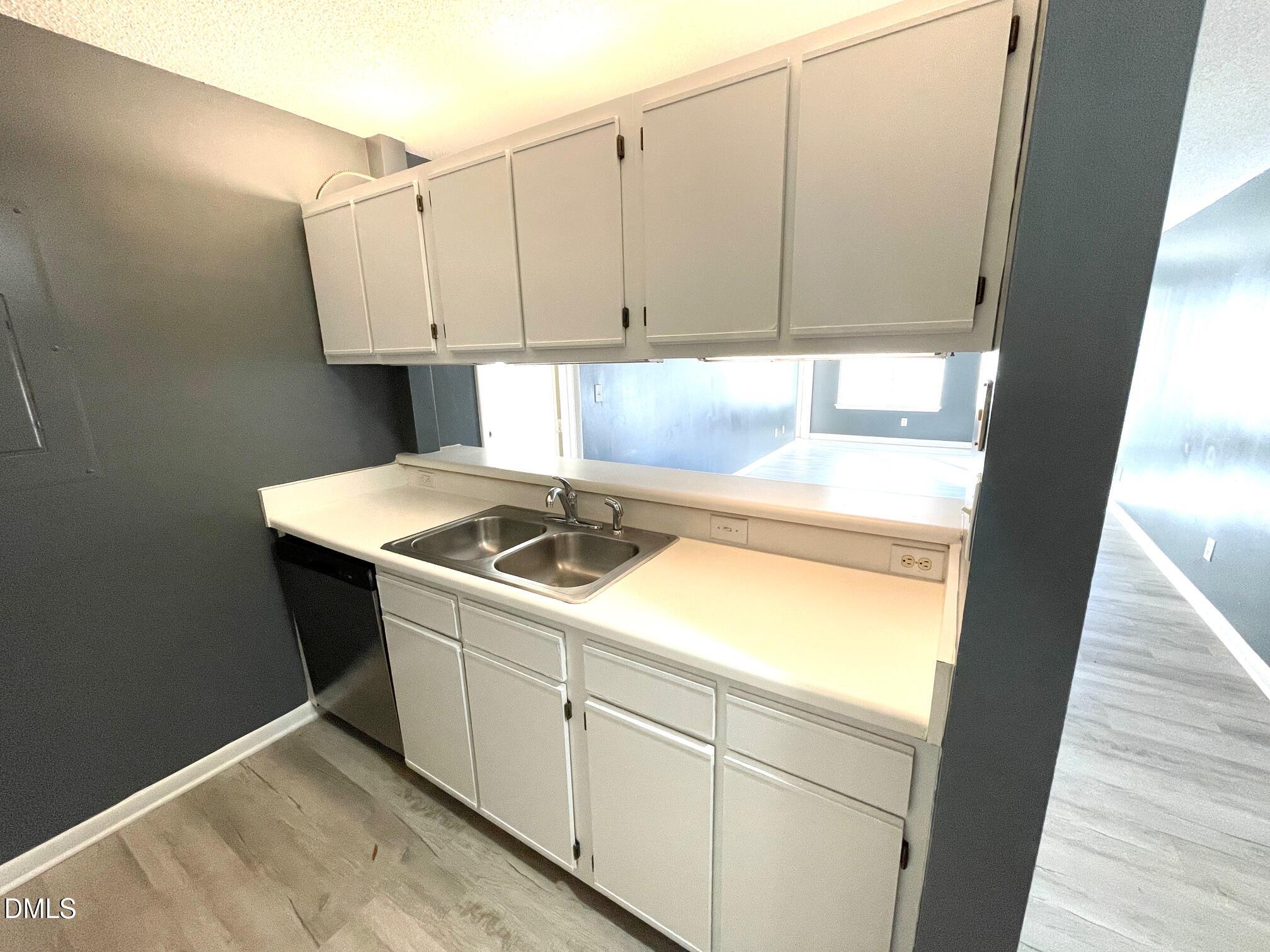 1230 University Court, Unit 204 Raleigh, NC 27606 - Photo 4 of 17 a utility room with dryer and washer