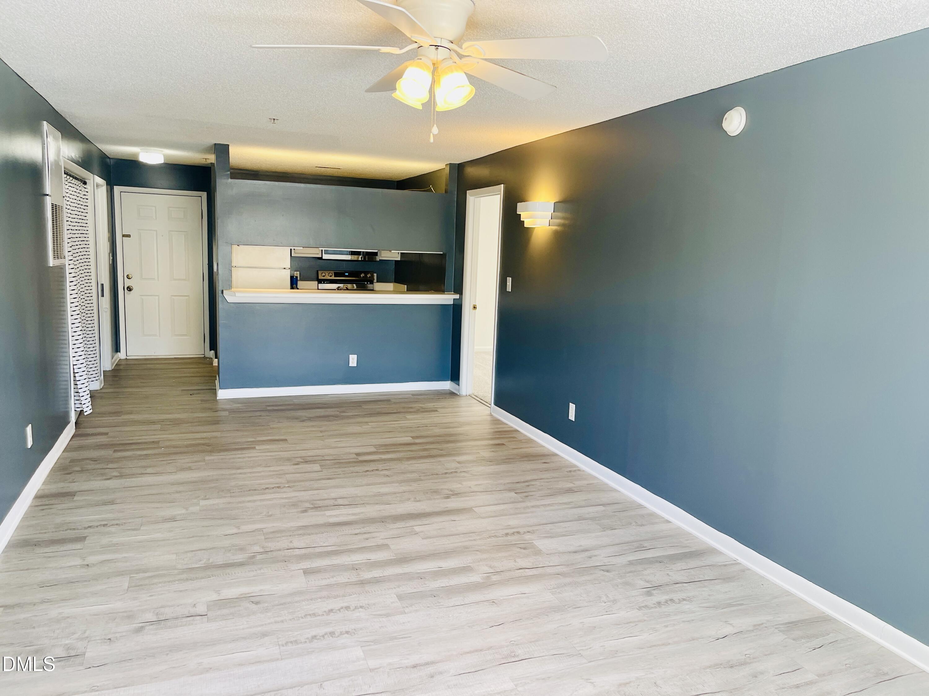 1230 University Court, Unit 204 Raleigh, NC 27606 - Photo 5 of 17 a view of kitchen with refrigerator and window