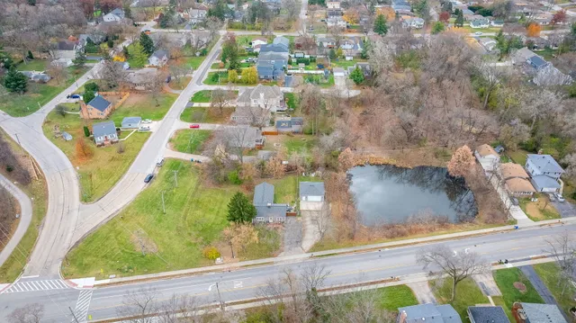 a view of a swimming pool with a yard