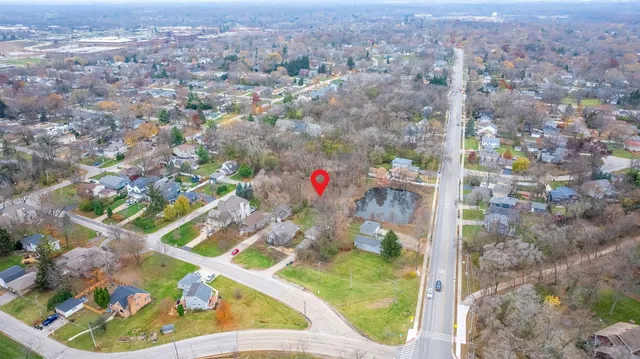 a view of a house with backyard porch and sitting area