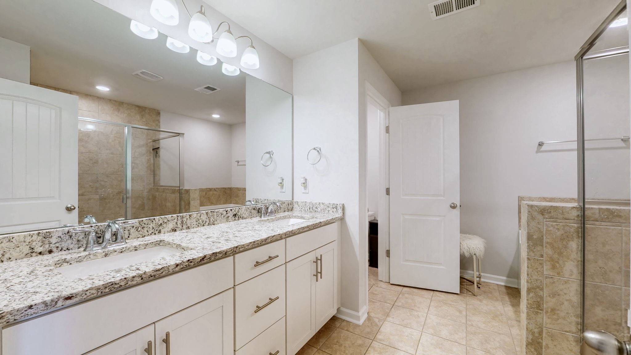 4235 Grapevine Loop Smyrna, TN 37167 - Photo 13 of 44 a spacious bathroom with a granite countertop sink mirror and toilet