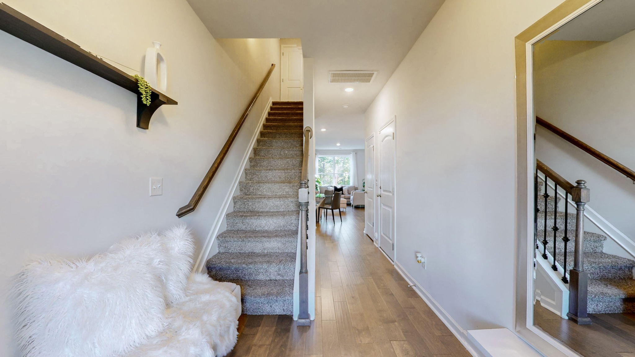 4235 Grapevine Loop Smyrna, TN 37167 - Photo 2 of 44 a view of staircase with lots of frames on wall and wooden floor