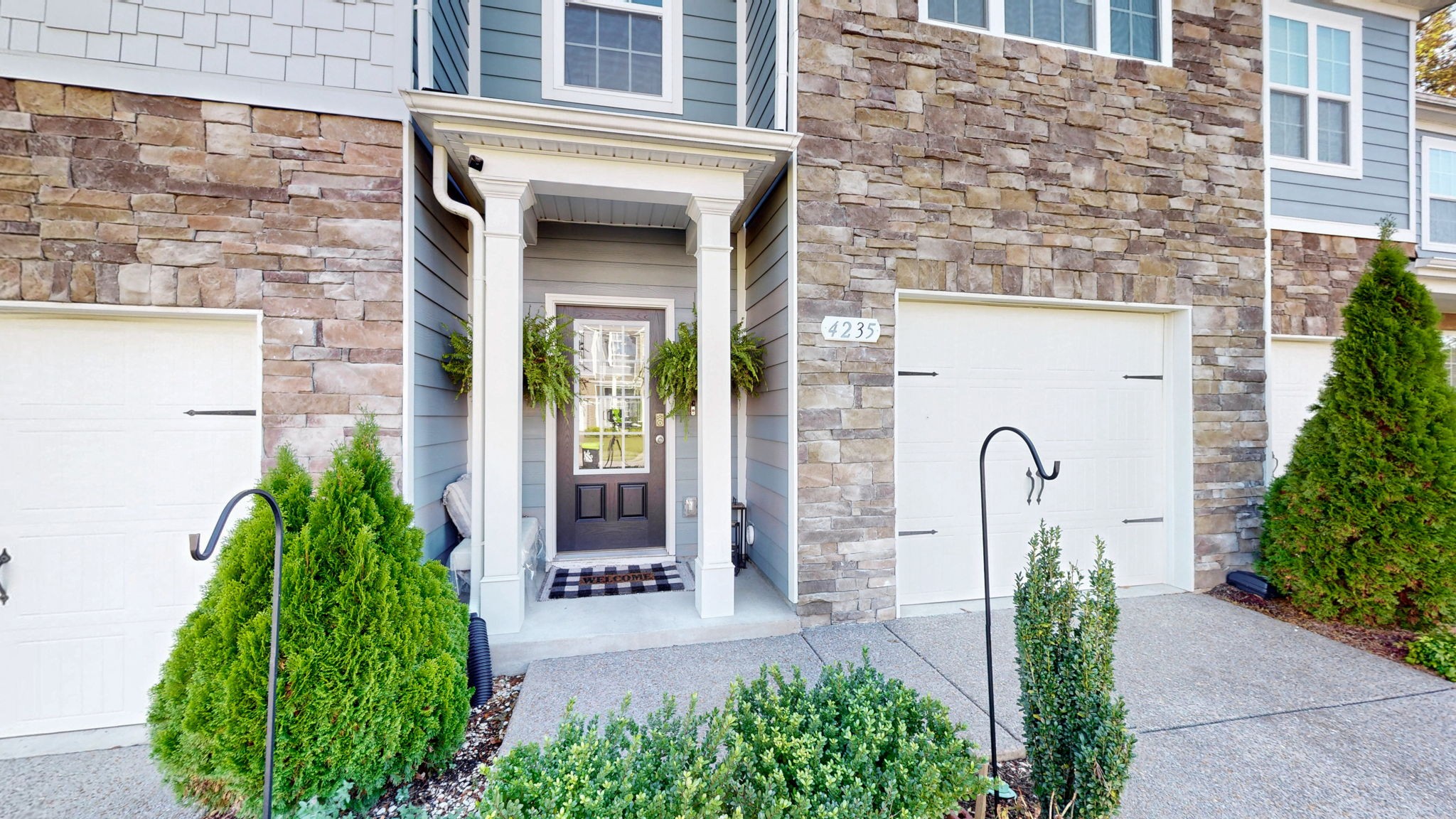 4235 Grapevine Loop Smyrna, TN 37167 - Photo 26 of 44 a front view of a house with a garden