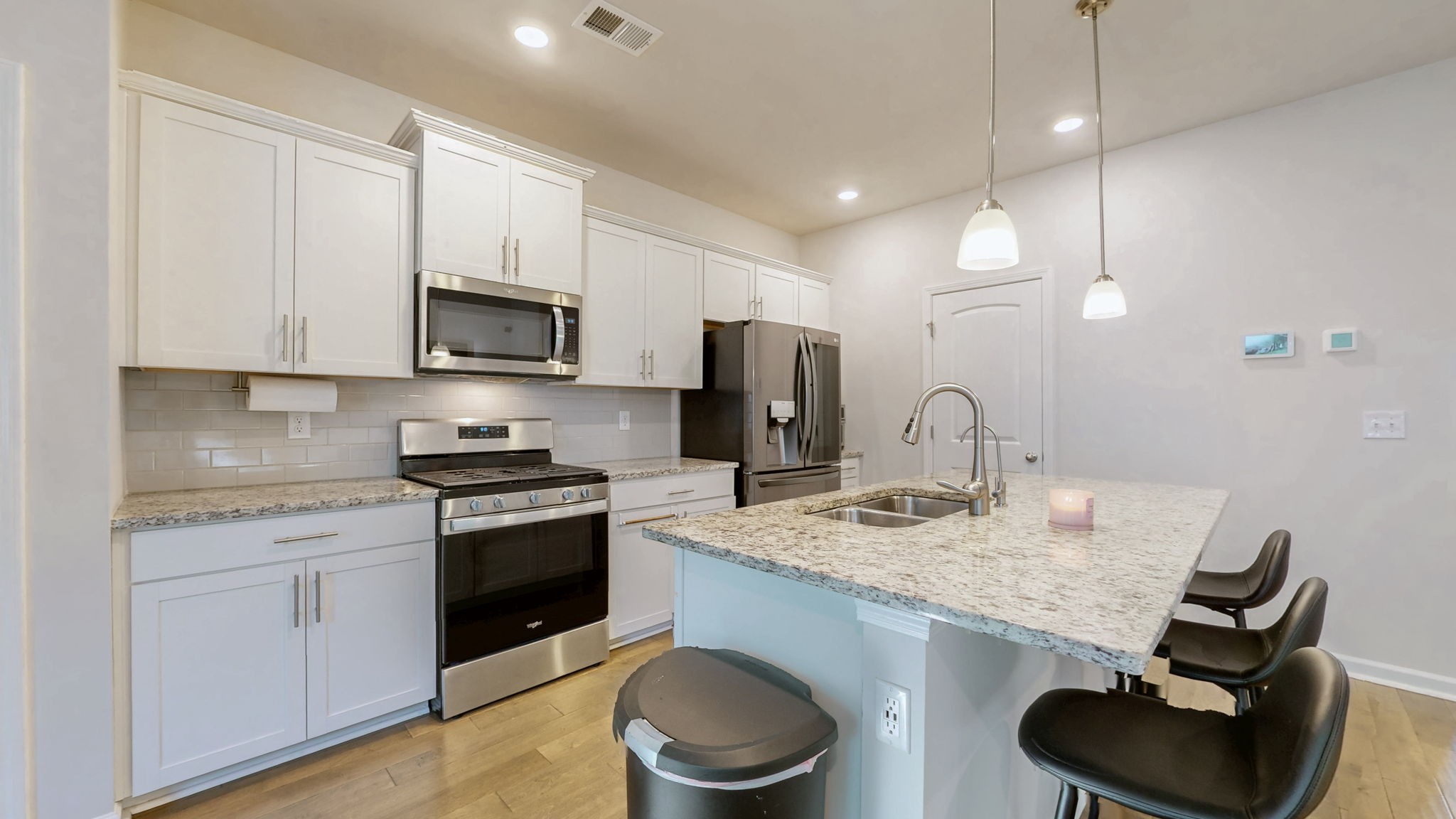 4235 Grapevine Loop Smyrna, TN 37167 - Photo 5 of 44 a kitchen with stainless steel appliances granite countertop a sink stove and refrigerator