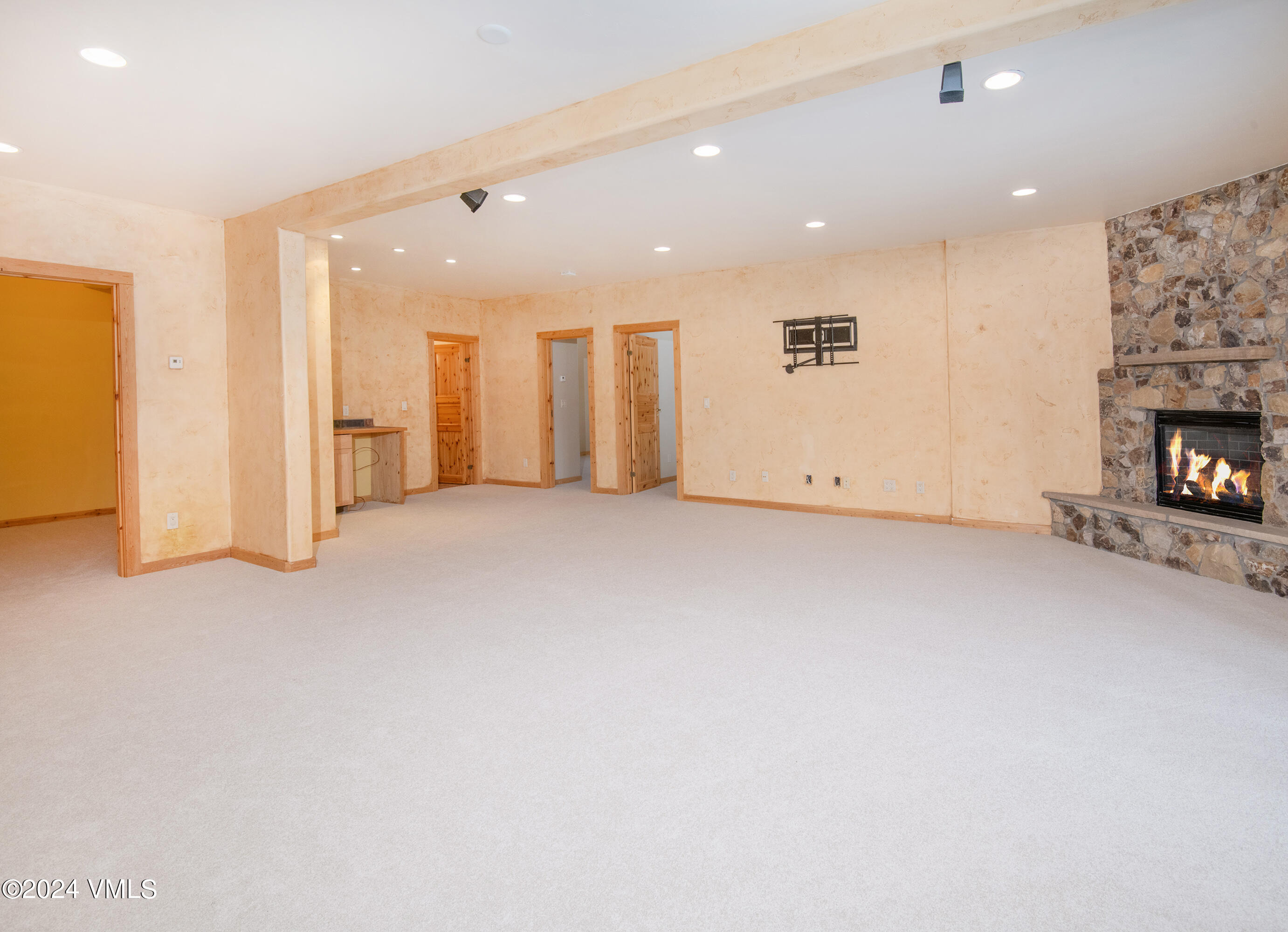 336 Castle Peak Road Eagle, CO 81631 - Photo 21 of 52 an empty room with furniture and a fireplace