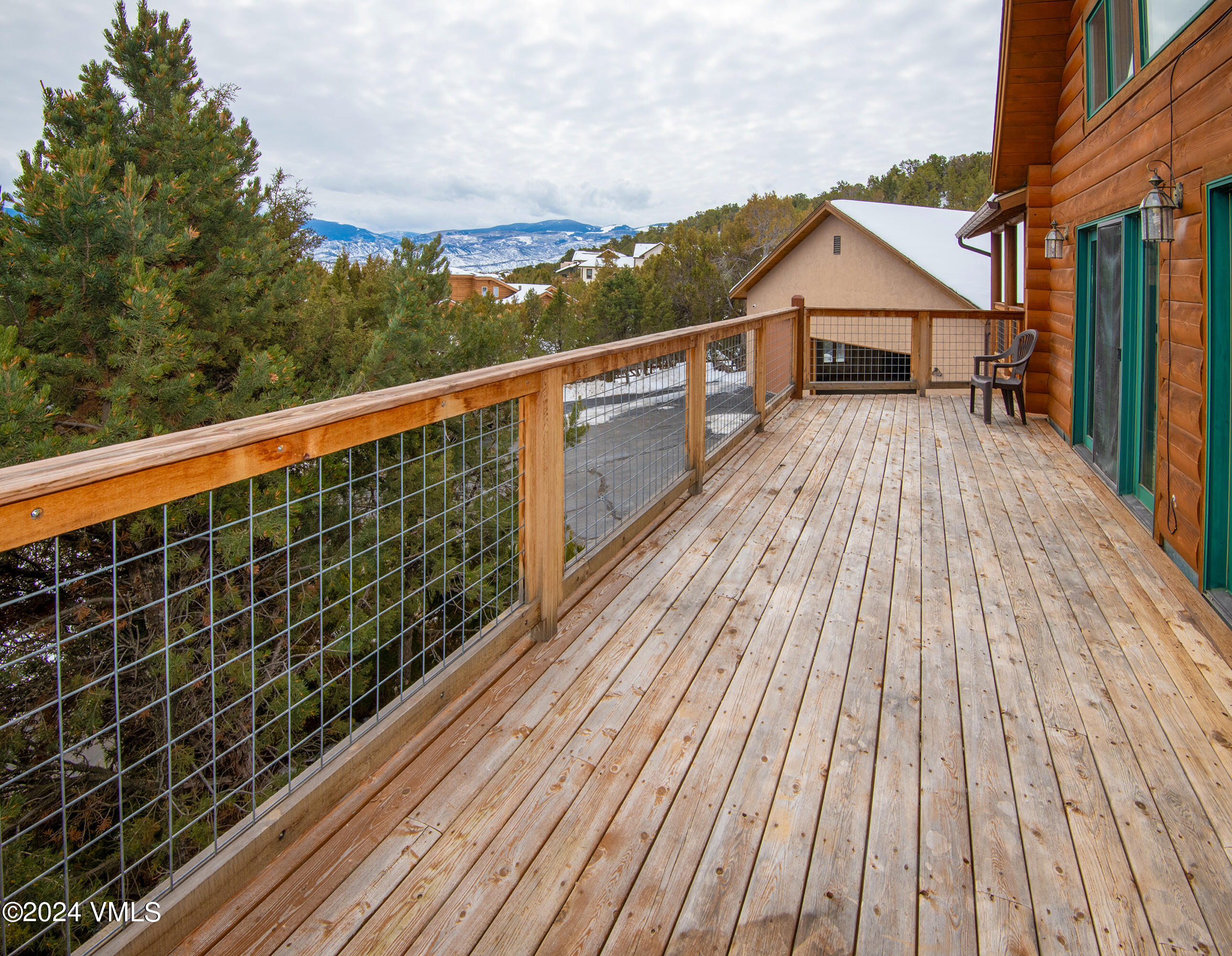 336 Castle Peak Road Eagle, CO 81631 - Photo 30 of 52 a view of a balcony with wooden floor and fence