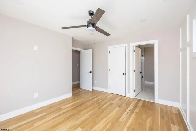 a bathroom with a shower and a mirror