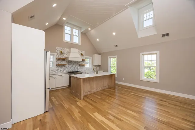 a large kitchen with a lot of counter space and a sink