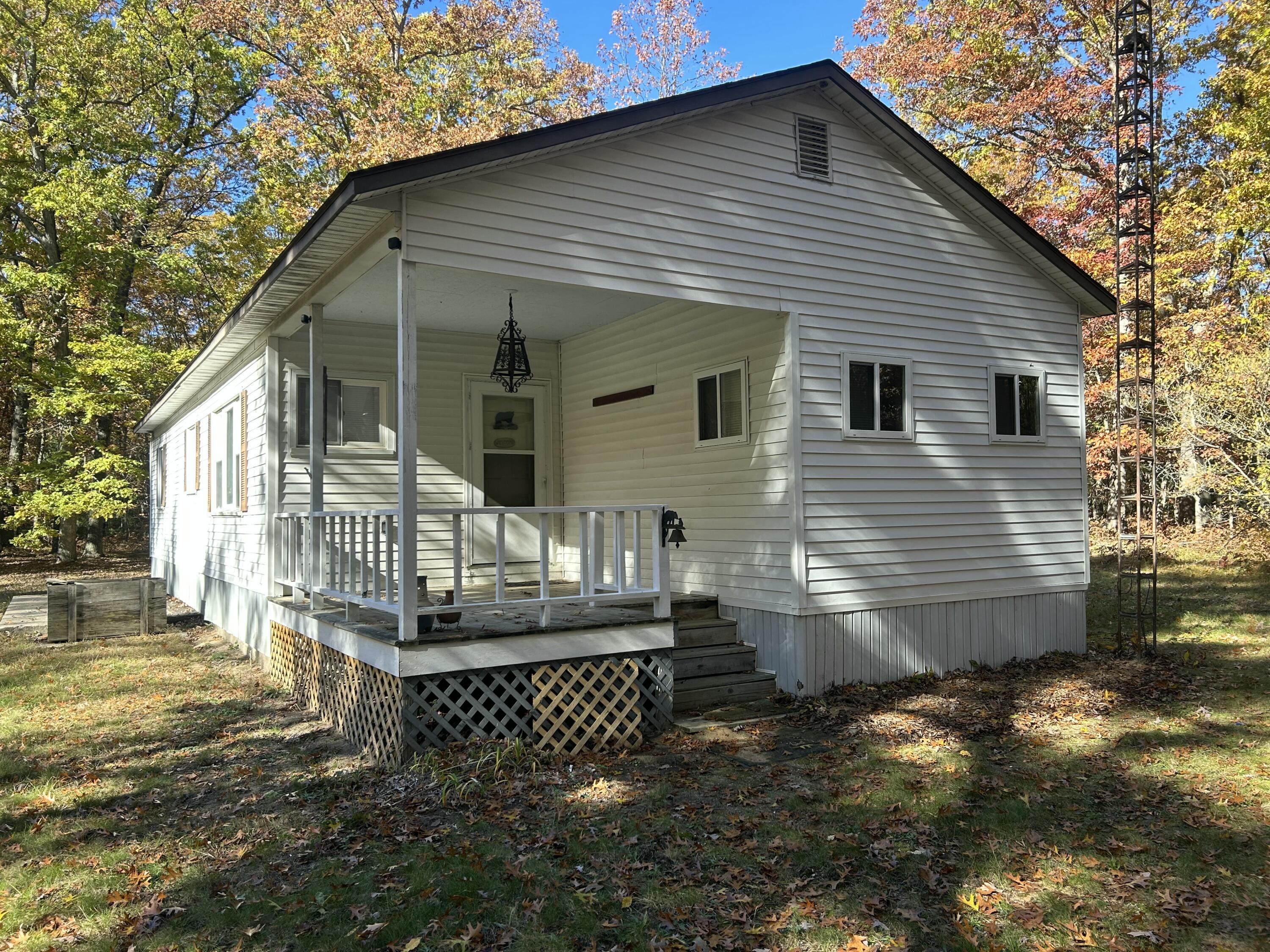 6970 West 8 Mile Road Irons, MI 49644 - Photo 3 of 23 Front Exterior