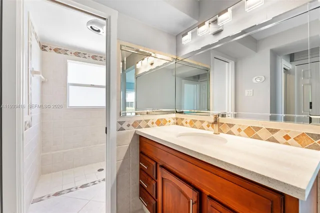 a bathroom with a sink and a mirror