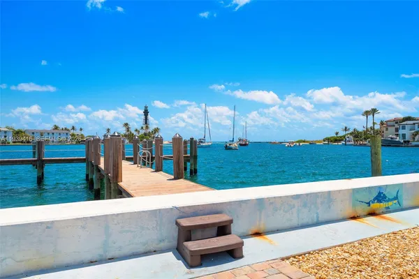 a view of a swimming pool with a yard and a fountain